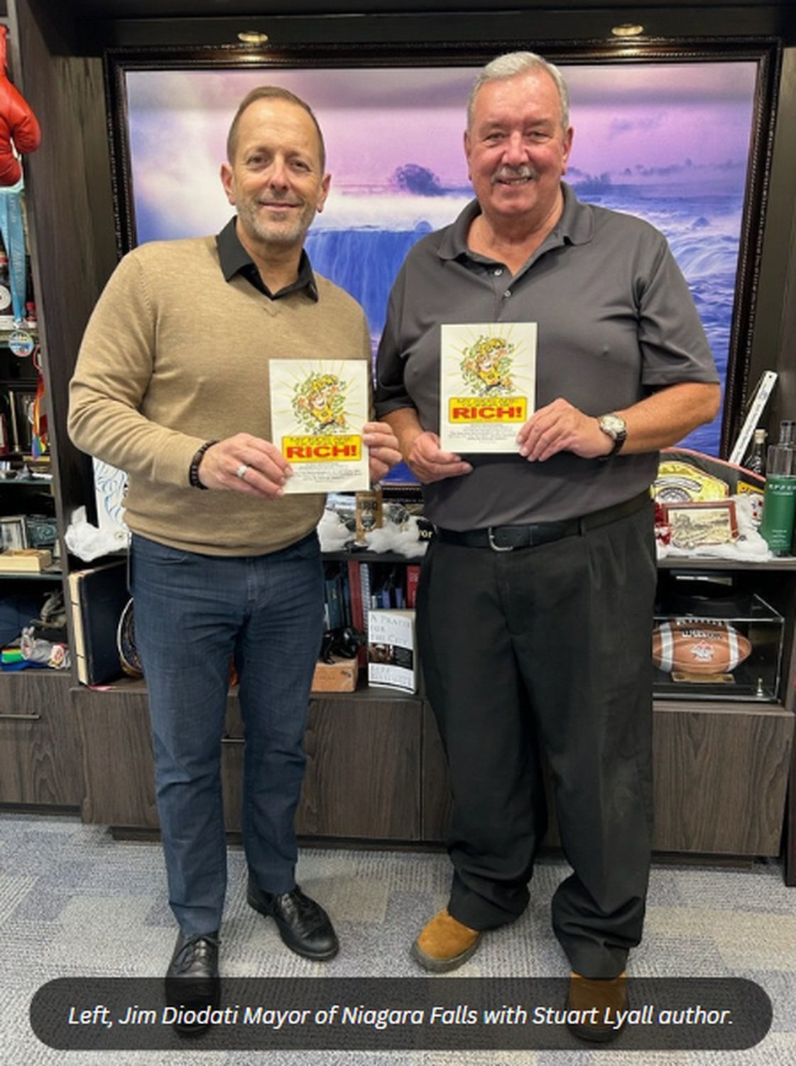Jim Diodati, Mayor of Niagara Falls, with author Stuart Lyall, each holding a copy of My Kids Are Gonna Be Rich